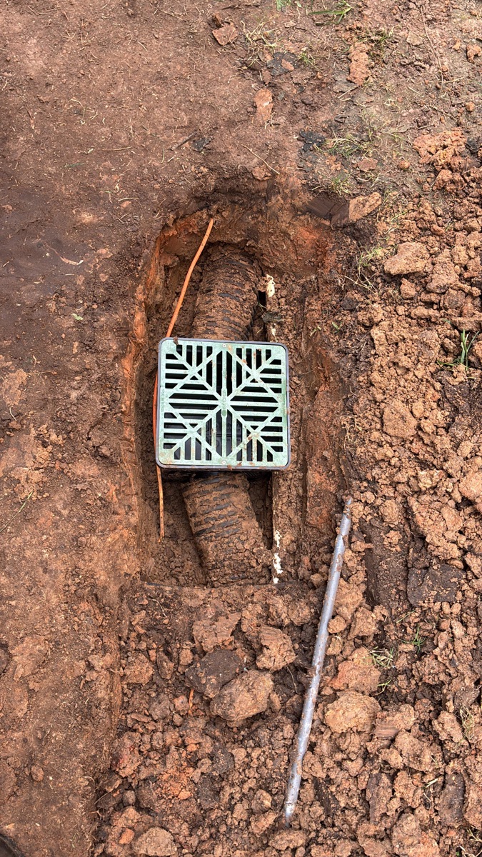 Catch basin and drain line installed in a Houston, TX yard