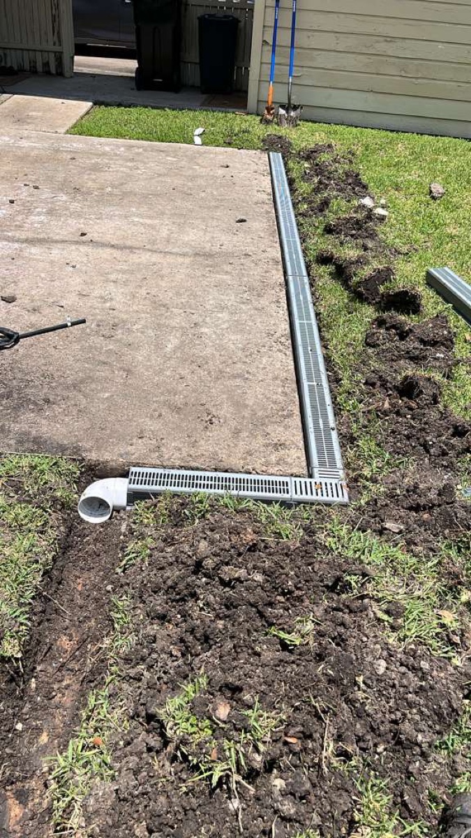 Channel drain installed along a driveway in Bridgeland, Cypress TX